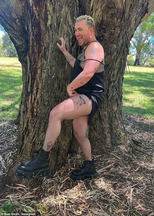 Fun in the sun: The non-binary singer dressed for the outing in a black mini dress which she teamed with a pair of fishnet stockings