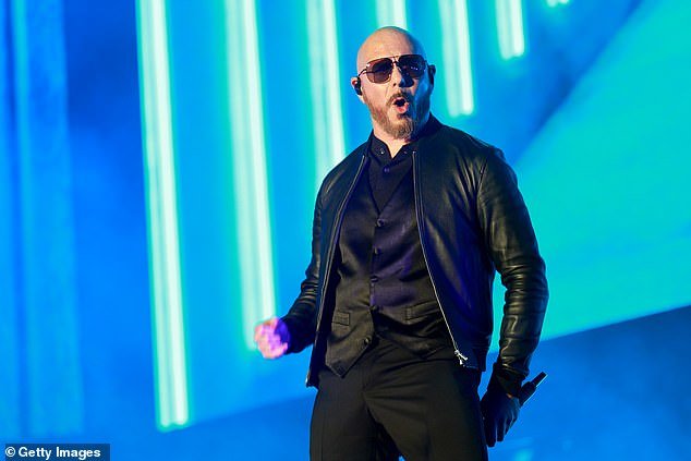 Dapper suit: Pitbull also took the stage for the night in an all-black suit, with no tie.