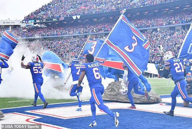 Bills players emerged from the tunnel waving 'Pray for Damar' and number three flags