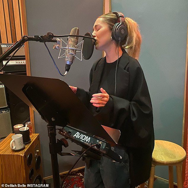 Working on music?  She also shared a snap of her dyeing her hair a reddish blonde and then a snap of herself singing in a music studio.