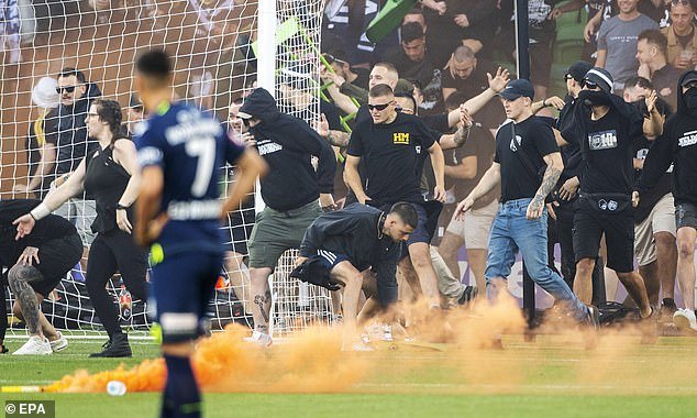 Victory fans (seen during the pitch invasion) are now barred from away games for the remainder of the 2022-23 A-League season.