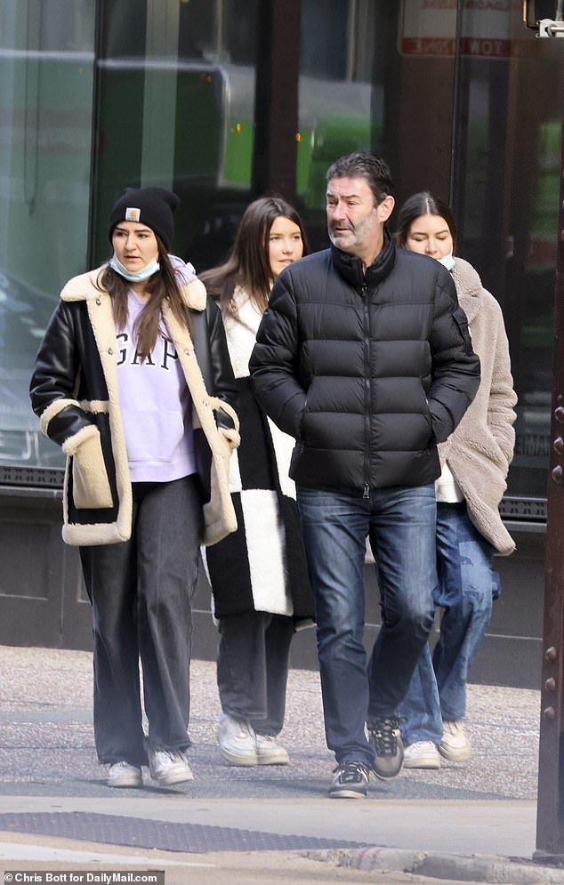 Steve Easterbrook and his daughters, Rebecca, Katie and Lauren, are seen on Chicago's Miracle Mile after leaving their $2.5 million 19th floor luxury condo.