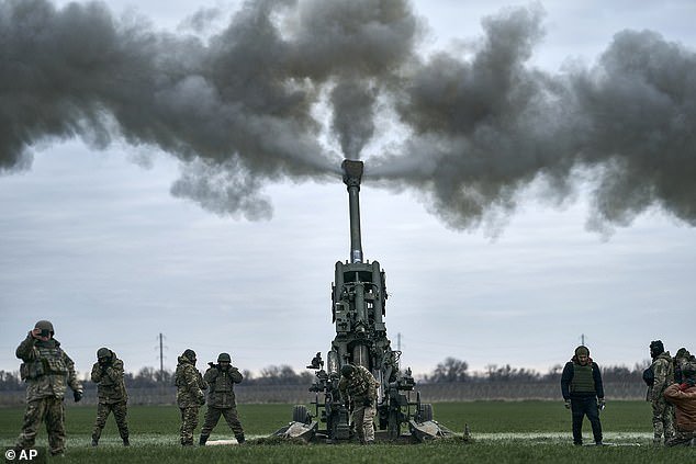 Ukrainian soldiers fire at Russian positions from a U.S.-supplied M777 howitzer in Kherson region