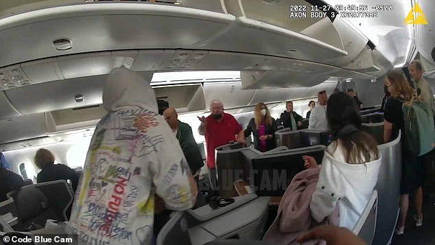 Newly released police footage from aboard the plane shows a sleepy Beckham arguing with other passengers who were upset about disembarking over his refusal to return to the terminal.  A passenger became the focus of Beckham's anger.  