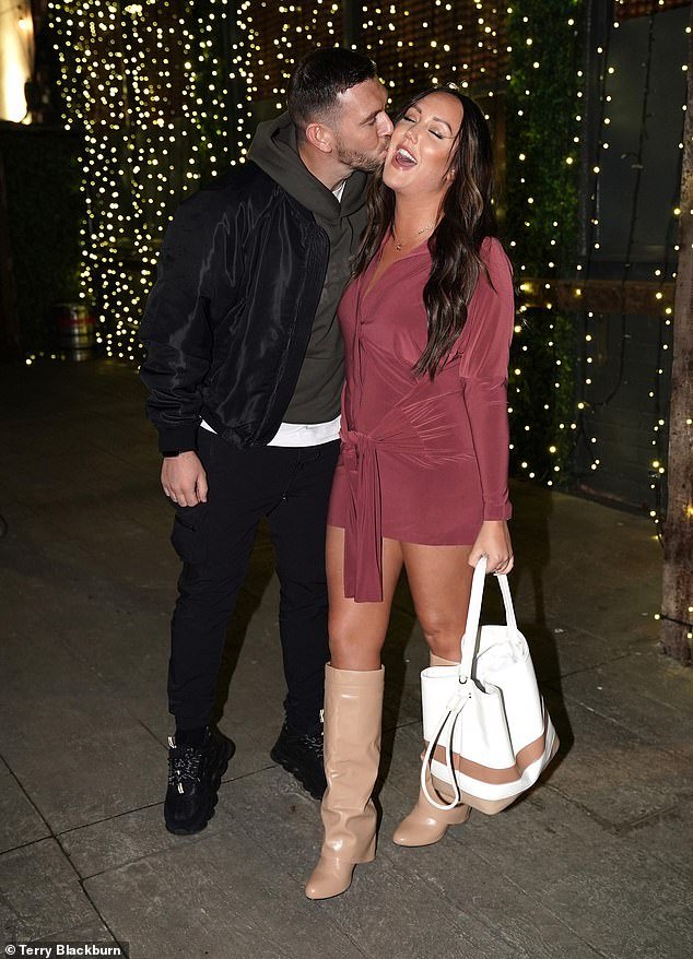 Cuddly: Charlotte laughed when her boyfriend kissed her on the cheek during their date night