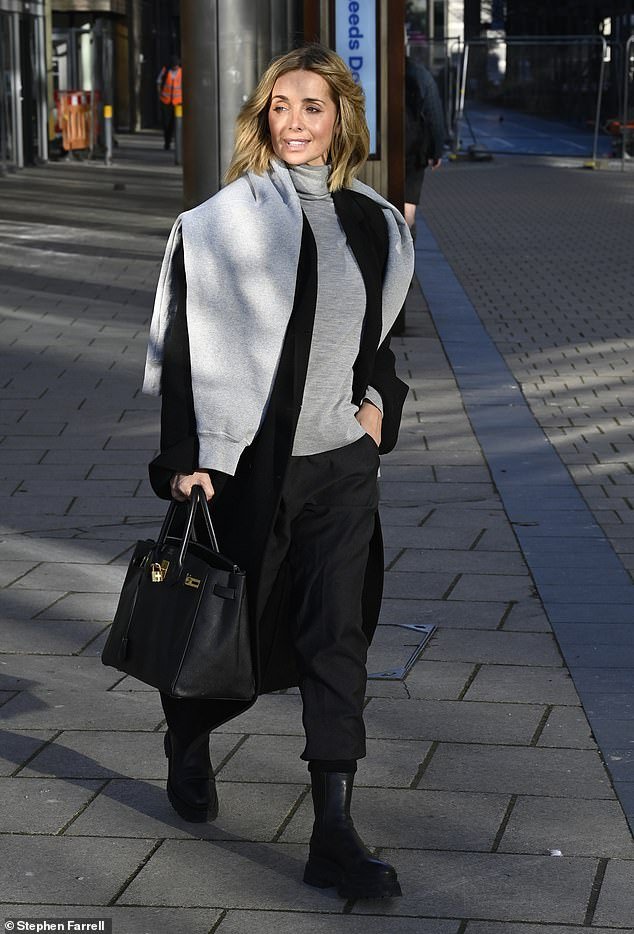 Stylish: The former Eternal singer, 48, looked effortlessly chic in a cozy gray turtleneck sweater, black pants and chunky leather boots