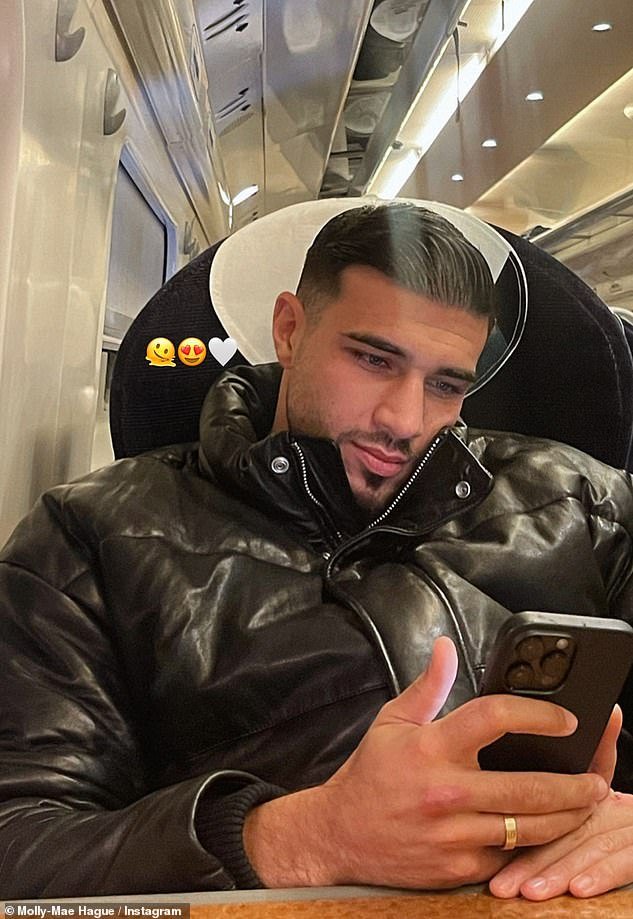 Her man: Molly-Mae also shared a snapshot of her boyfriend on the same train, without revealing where they were headed or, indeed, if they had secretly welcomed their son as well.