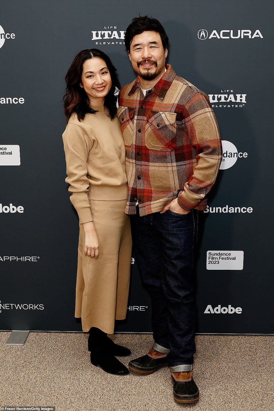 Randall, who wore a plaid shirt and duck boots, was joined by his wife of 13 years, Candy Coated Christmas actress Jae Suh Park.