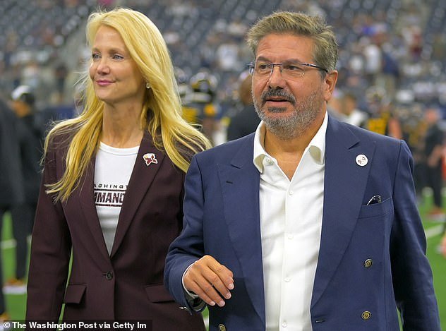 Washington Commanders owners Tanya Snyder, left, and Dan Snyder on the field before the Dallas Cowboys defeated the Washington Commanders 25-10 at AT&T Stadium on October 2.