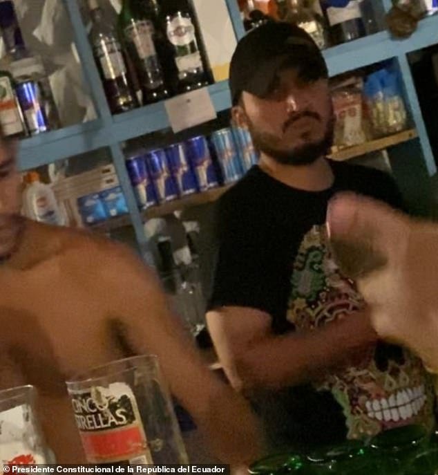 Germán Cáceres (right) was hiding in Palomino, a town on Colombia's Caribbean coast where he also worked as a bartender.