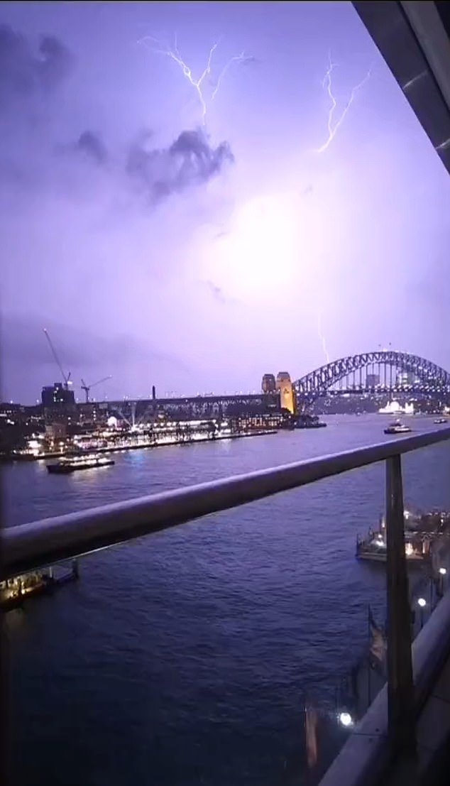 Pictured: Massive lightning strikes over Sydney's iconic Harbor Bridge