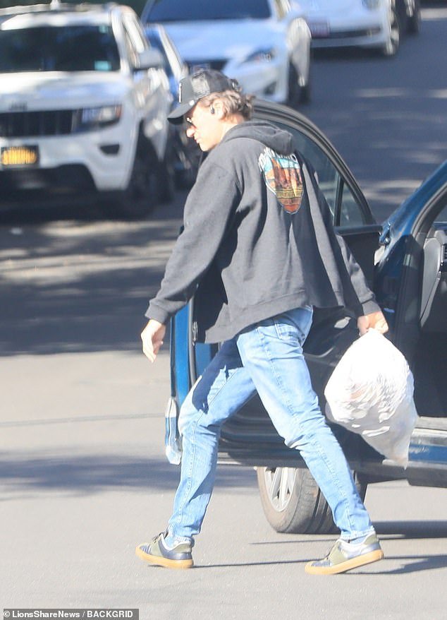 The footage shows Matthew looking somewhat somber while running errands in the City of Angels, where he and his wife had lived with their nine-year-old son, Andros.