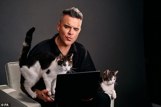 'I Love Cats': Robbie has taken his career as a pop star in a new direction, as he'll be playing the face of cat food brand Felix in an ad, instead of going on stage.
