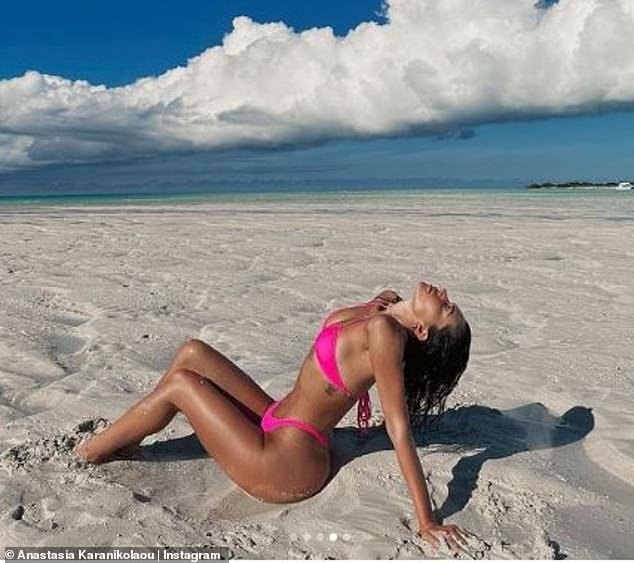 Sexy: Anastasia posed in some sexy poses on the sand and in the water for the snap carousel