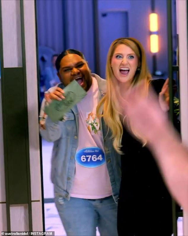 Judge Meghan Trainor (right) hugs a young hopeful (left) during auditions