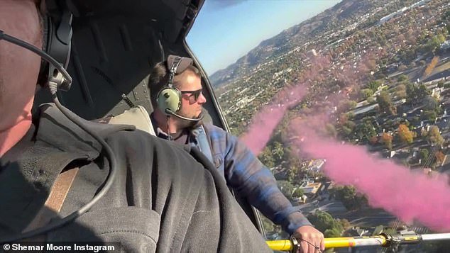 Making memories: The couple found out they were having a girl when a helicopter spewed pink smoke