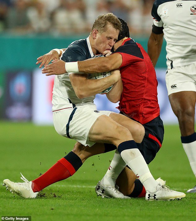 USA star Will Hooley is caught with a high shot to the head at the Rugby World Cup in 2019. The RFU's new directive aims to prevent head injuries from tackles like this.