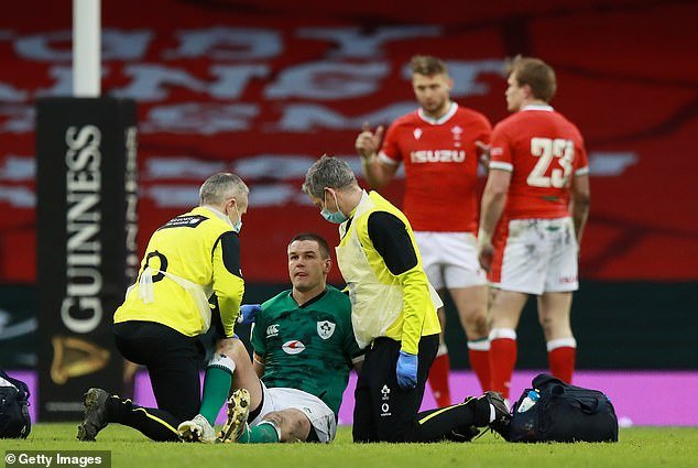Irish fly half Johnny Sexton, pictured receiving attention after a big hit against Wales in 2021, is also staunchly against the idea of ​​reducing tackling.