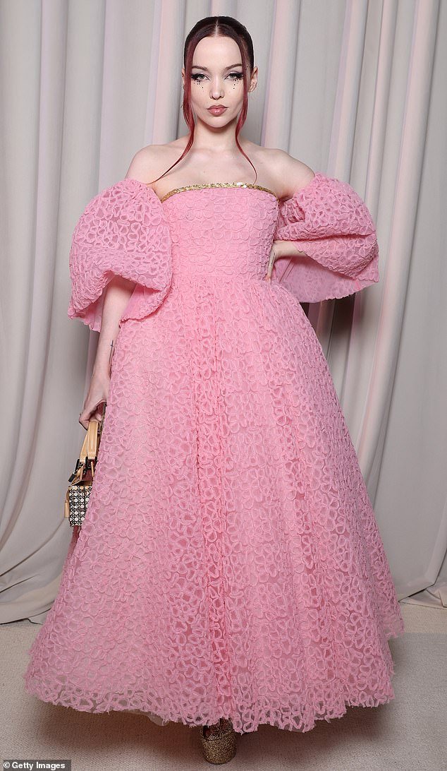 Eye-catching: Actress Dove Cameron, 27, turned heads in a pink dress with a huge, voluminous skirt and puff sleeves at the Giambattista Valli Fashion Week show