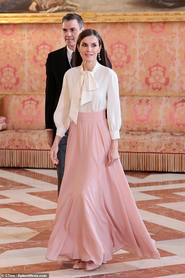 The always elegant royal wore a flowing light pink skirt for the occasion, which she paired with a crisp white blouse.