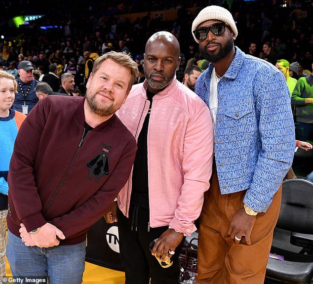 James, Corey and Dwyane: The late-night talk show host also posed for photos with Corey Gamble and NBA legend Dwyane Wade while chatting courtside.