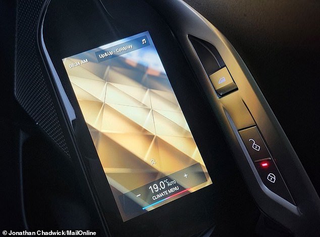 Touch screens for controlling car functions are built into the handles of both passenger doors