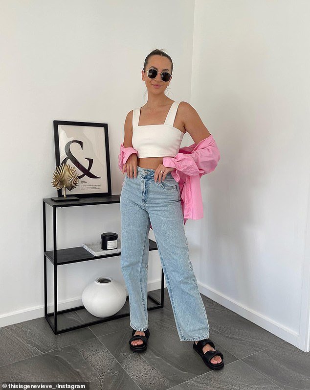 Genevieve also paired the jeans with a white crop top from Zara, as well as black sandals and a pink t-shirt, both from Target.