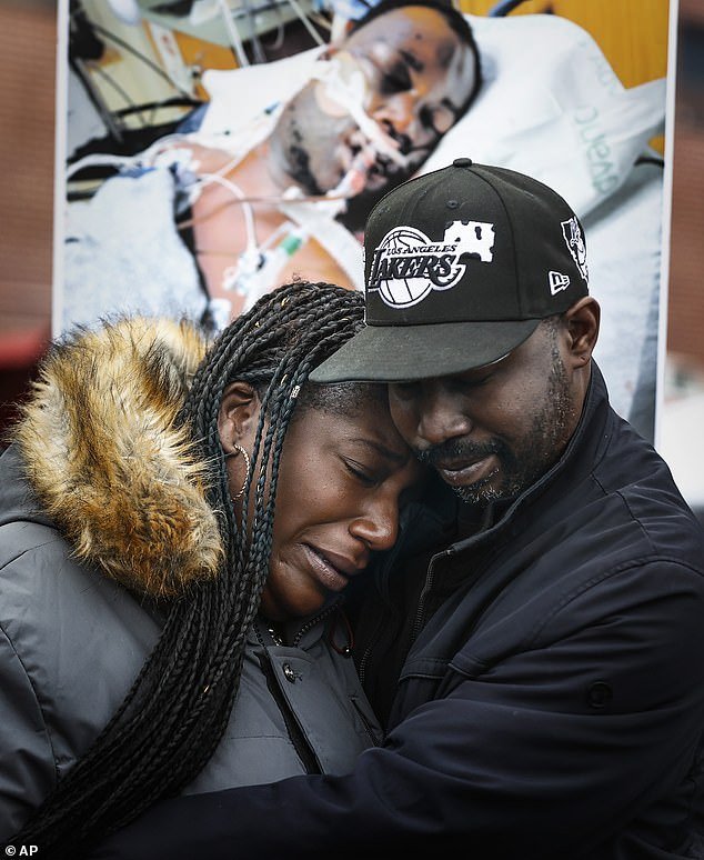 Kenyana Dixon is comforted during a rally for her brother Tire Nichols at the National Civil Rights Museum on Monday, January 16, 2023.