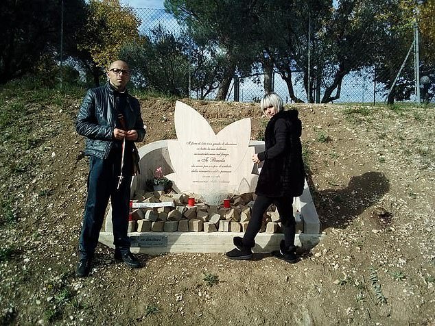 Mastropietro's parents Stefano and Alessandra Verni stand by a memorial for their daughter