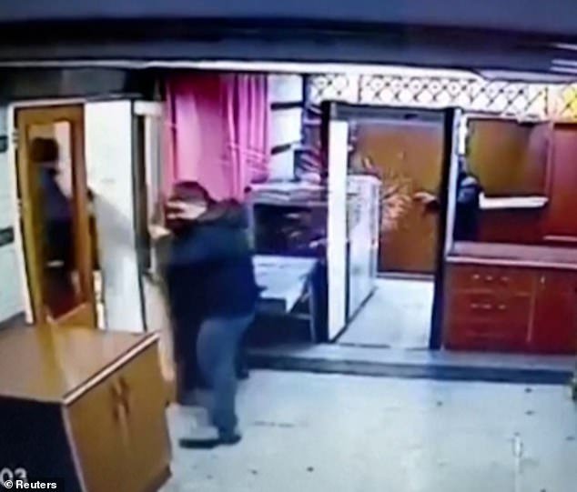 Shocking footage shows the killer barging into the embassy and pointing his firearm at the terrified staff