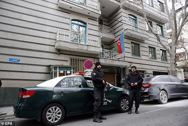 Iranian police stand guard in front of the Azerbaijan Embassy in Tehran after today's attack