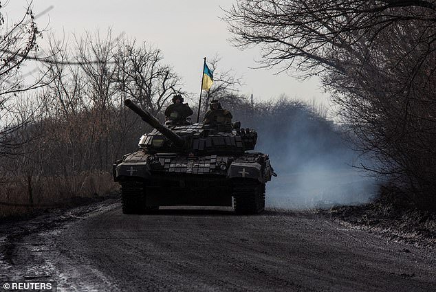 Ukrainian soldiers are seen riding a Soviet-era T-72 tank, widely used in the ongoing conflict, in the Donetsk region on January 20.