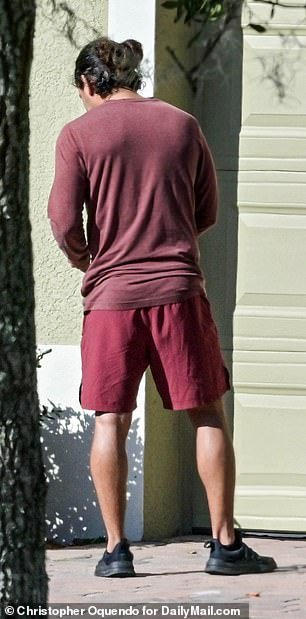 Exclusive images obtained by DailyMail.com show Fernandez dressed casually in maroon shorts and a tank top.