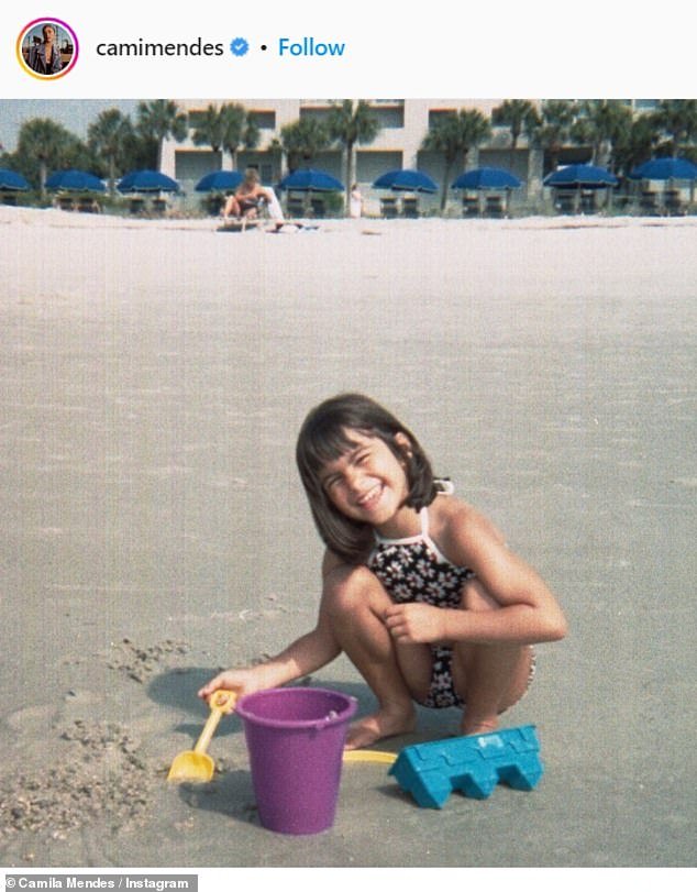 A cutie at a young age: Here she is seen on the beach with her shovel