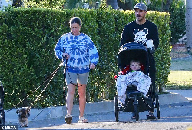 Comfortable look: The couple wore very comfortable outfits and were joined by their one-year-old son and their two dogs