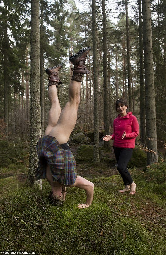 Hunk in a headstand: The Mail's Jane doesn't know where to look when Finlay does a headstand
