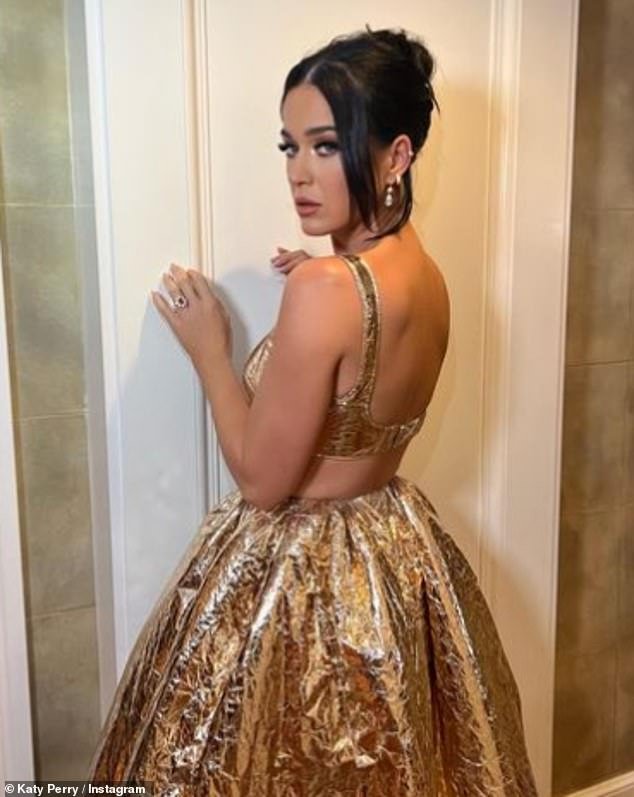 Golden Girl: In addition to snaps with Miranda, Katy gave fans a sneak peek at her glamorous dress