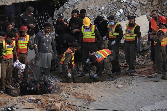 A frantic rescue mission is now underway at the mosque as emergency personnel search for survivors amongst the rubble (pictured)