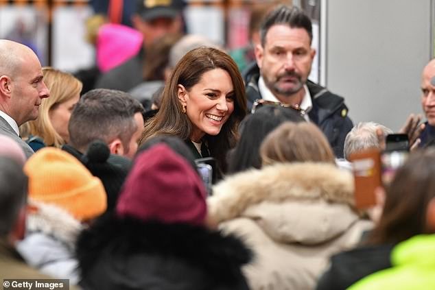While touring the iconic market, the princess politely ignored a wolf whistle from a royal fan.