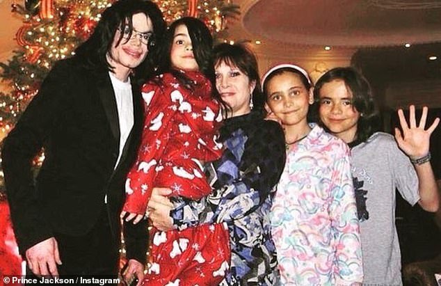 Family time: The Bad singer's eldest son Prince, 25 (far right) shared a series of throwback photos on social media  Seen here with his father, his younger brother Prince Michael aka Blanket, and his sister Paris