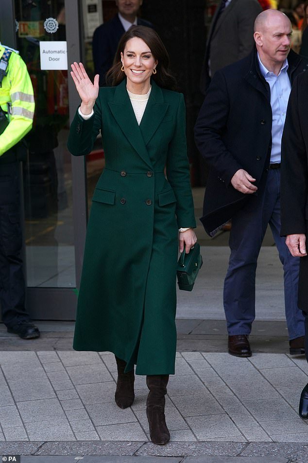 Kate pictured waving to the crowd after her tour of Kirkgate Market in Leeds, West Yorkshire this morning
