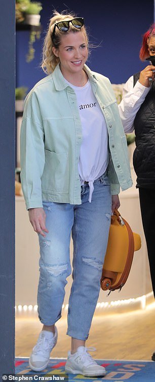 Casual look: The actress looked relaxed in a white T-shirt and ripped jeans teamed with a mint green jacket and sneakers as she made her way towards a waiting car