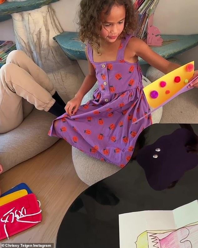 Beauty: Luna wore a cute purple dress with ladybugs on it