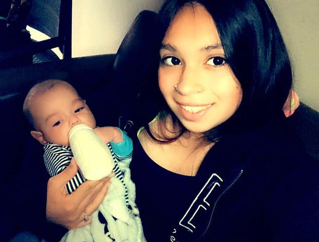 The infant was found cradled in the arms of her mother, Alissa Parraz, in a ditch outside the homes.