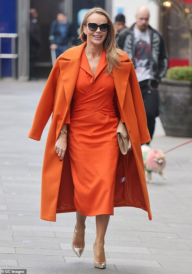 A dream in tangerine: Amanda Holden made sure all eyes were on her when she made a stylish Heart FM exit in an orange ensemble on Tuesday