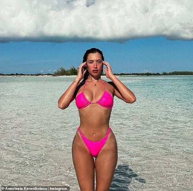 Hot: Stassie looked incredibly sexy in a skimpy bright pink bikini with a tank top and French cut thong as she basked in the warm Caribbean breeze