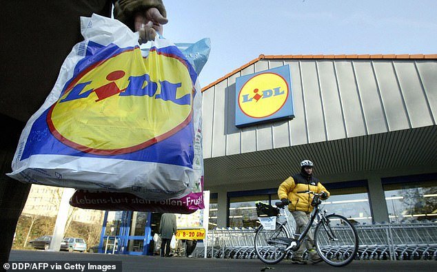 Christmas cracker: Lidl has collected 1.3 million customers in the four weeks to December 25 from the likes of Tesco, Sainsbury's, Asda and Morrisons