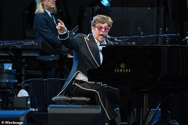Elton John's concert in Auckland was canceled on Friday after torrential rain lashed the New Zealand city.  Elton is pictured