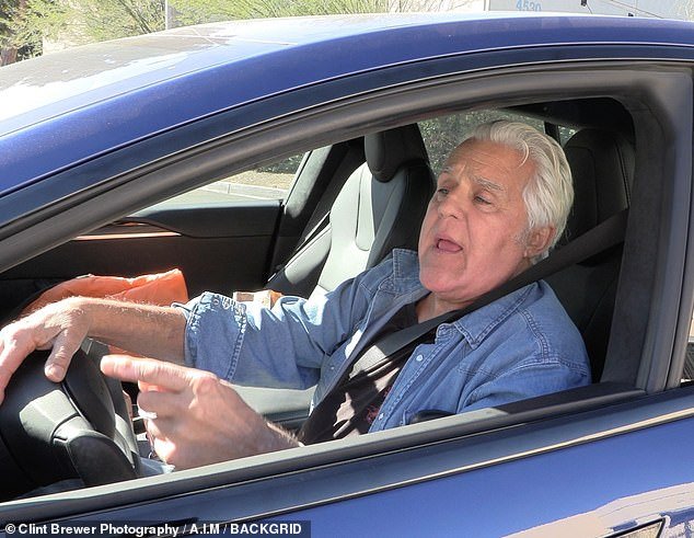 Comedian Jay Leno appeared uninjured behind the wheel of his car as it pulled into his warehouse in Burbank, California on Friday.