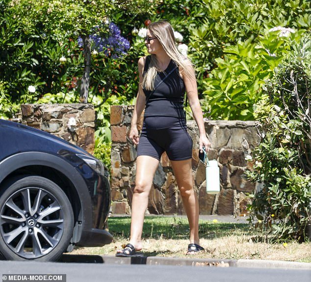 Jimmy Bartel's pregnant girlfriend, Amelia Shepperd, showed off her growing baby bump in sportswear as she stepped out in Melbourne on Monday.